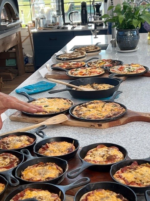 A table full of pizzas