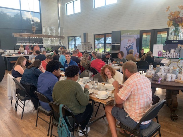 A group of people sitting at tables