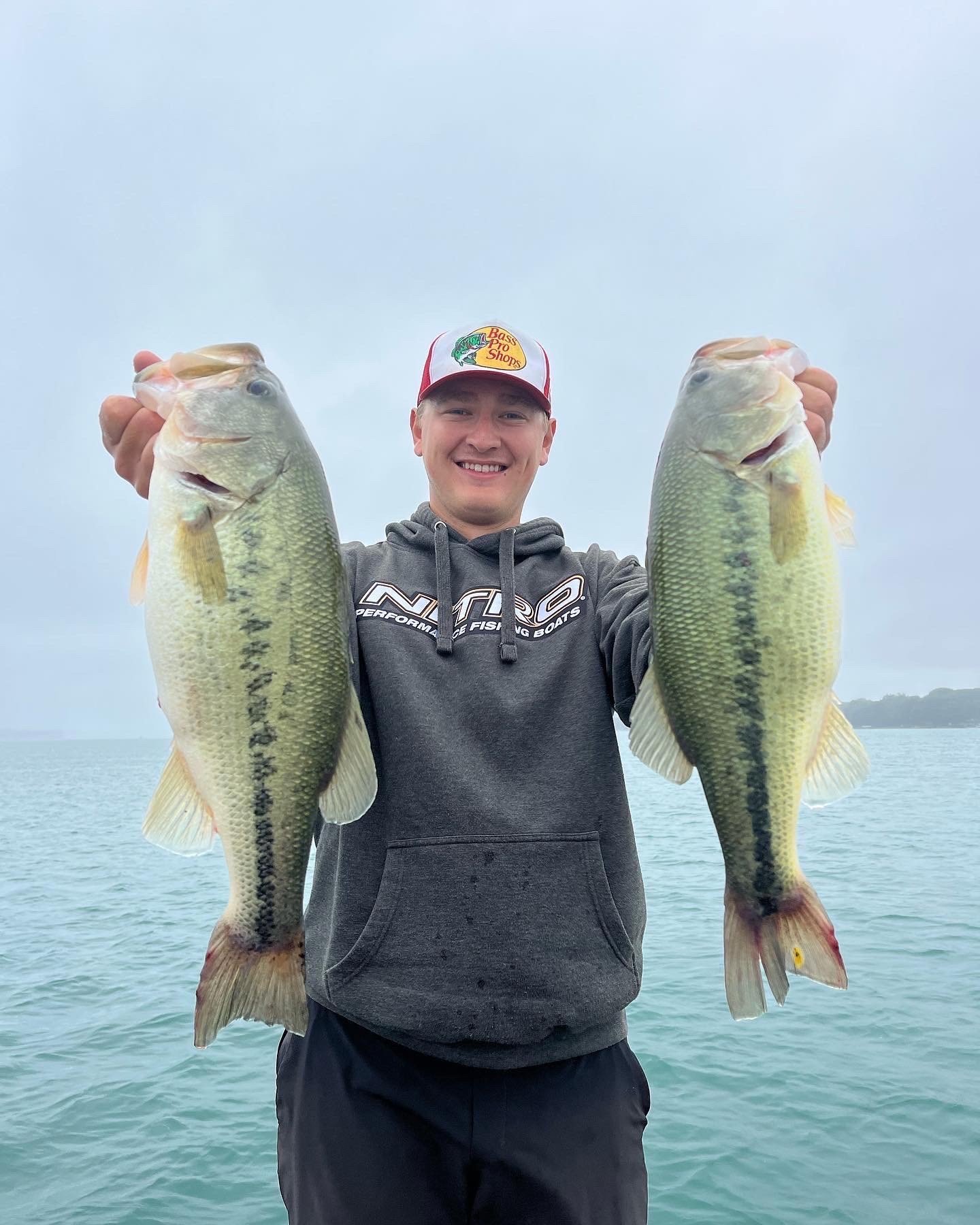Cole alternate photo man holding fish
